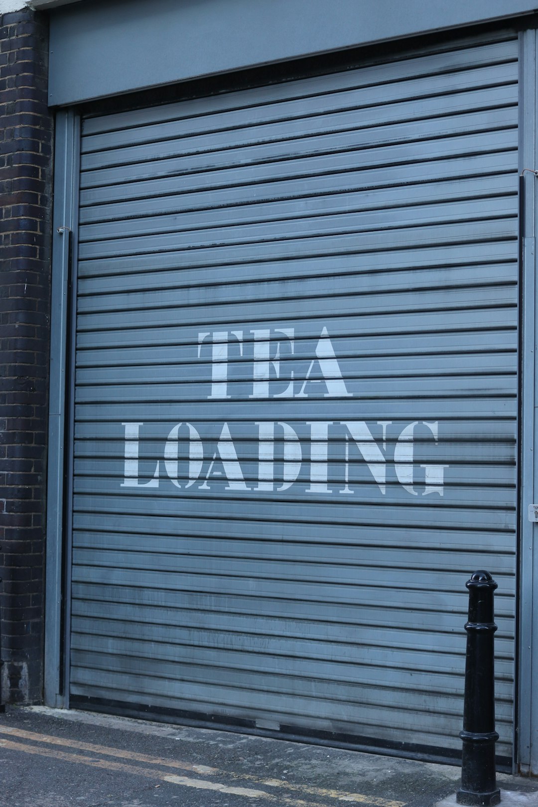 grey-metal-shutter-with-tea-loading-text-yvijfobgbig